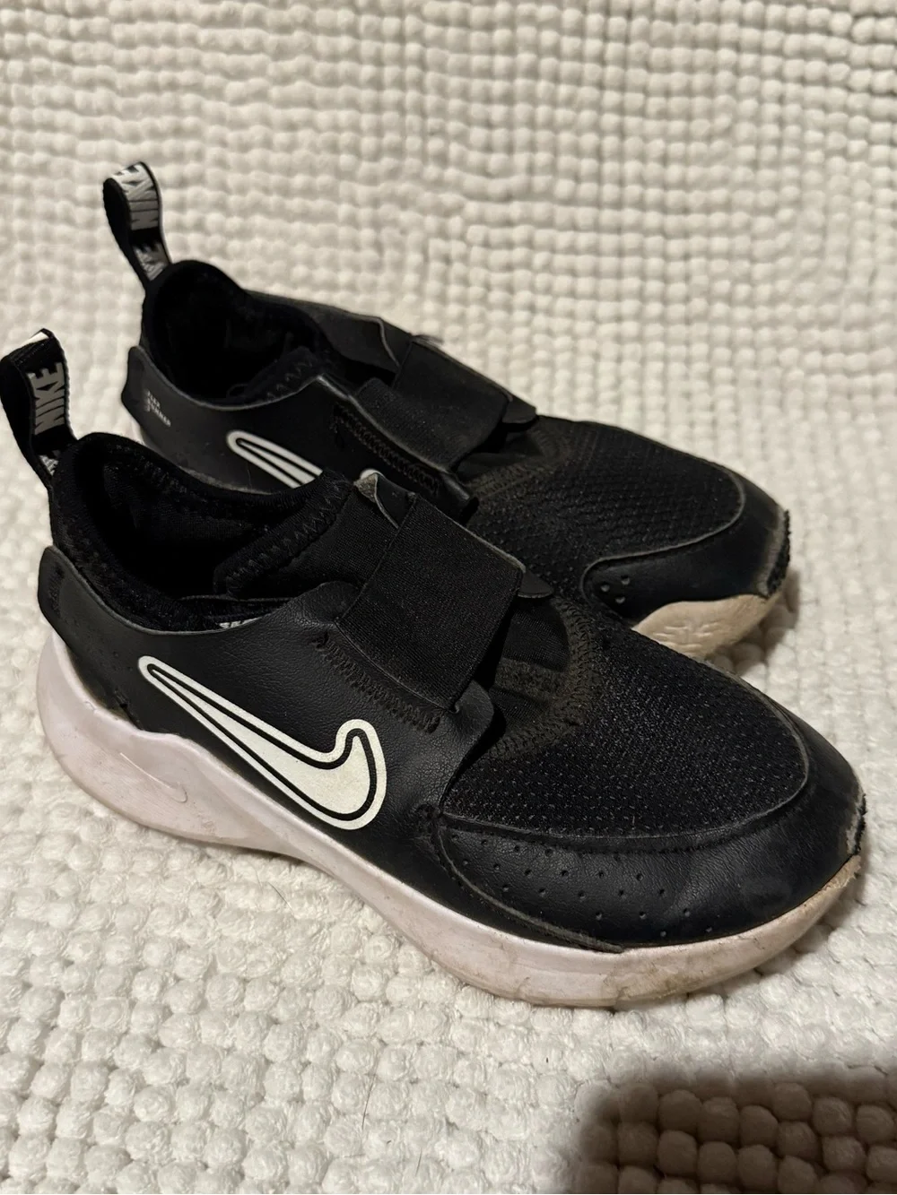 Nike Kids Black Slip-On Sneakers with White Swoosh